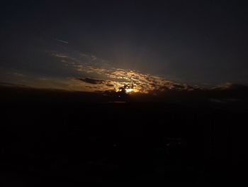 Silhouette landscape against sky during sunset
