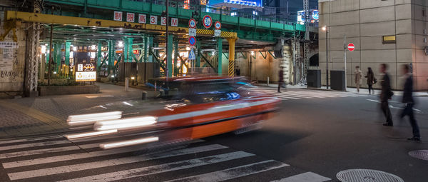 Blurred motion of vehicles on road at night