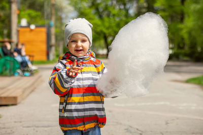 Portrait of boy standing on snow