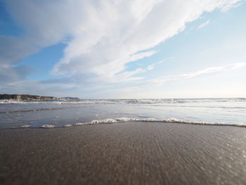 Scenic view of beach against sky