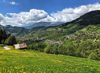 Scenic view of landscape and mountains against sky