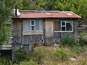 Wooden derelict house in tortel, chile. still, it is home to someone