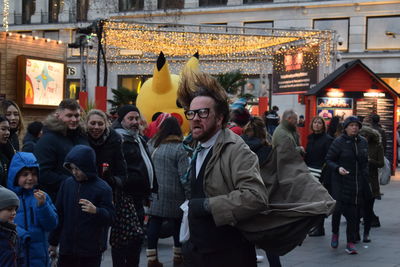 People standing on street in city during winter