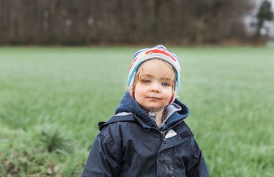 Portrait of cute girl standing outdoors