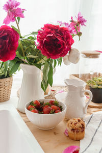 The kitchen countertop is decorated with peonies. interior details.