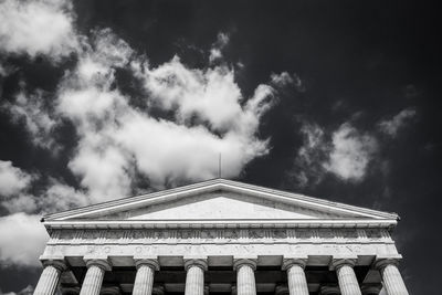 Low angle view of building against cloudy sky