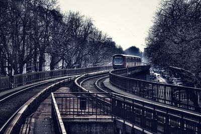 Train on railroad track against sky