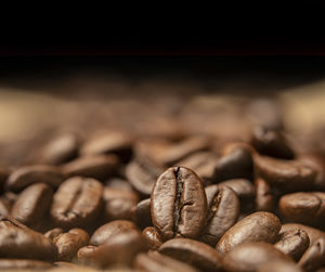 Close-up of coffee beans on table