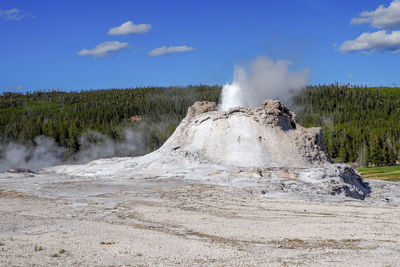 Small geyser erupting in the old faithful geyser area in the yellowstone national park, wyoming