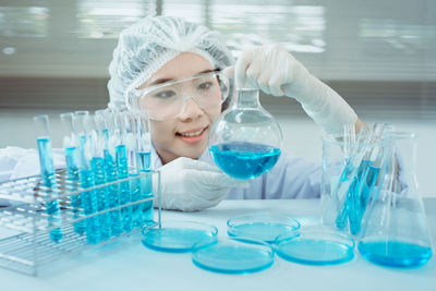 Female scientist experimenting in laboratory