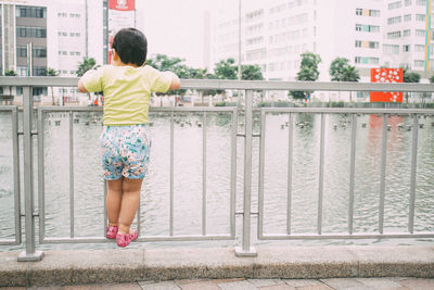 Full length of child on bridge
