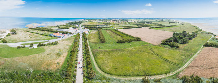 High angle view of land and sea against sky