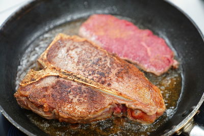 High angle view of meat in cooking pan