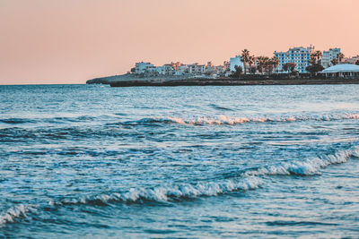 Scenic view of sea against clear sky during sunset