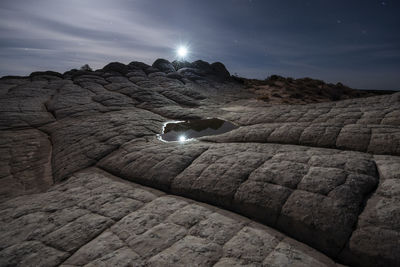 Strange rock formations in under a night sky in white pocket ari
