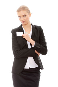 Young woman using smart phone against white background