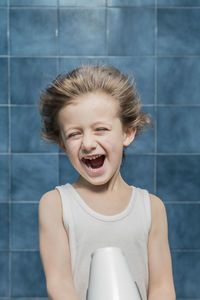 Smiling boy with tousled hair