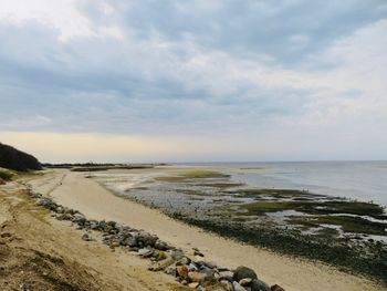 Scenic view of beach against sky