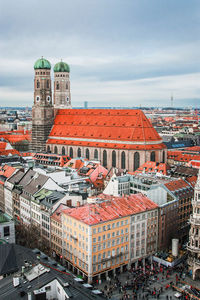 Culture of munich. aerial view on the famous church of our lady and buildings at marienplatz 