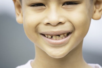 Close-up portrait of smiling boy