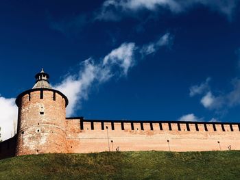 Low angle view of fort against blue sky