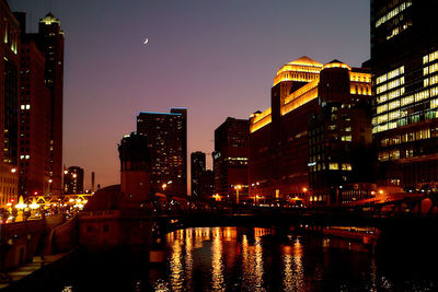 Illuminated buildings in city at night