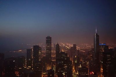 Illuminated cityscape at night