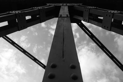 Low angle view of silhouette bridge against sky