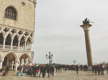 People in front of historical building