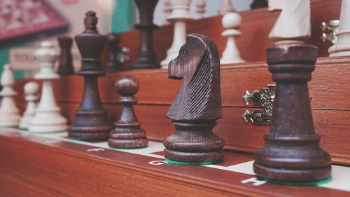 Close-up of chess pieces on table