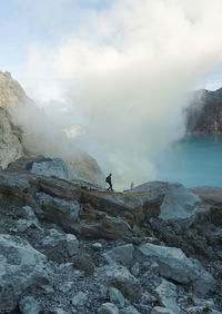 Tourist going to the crater of mount ijen.