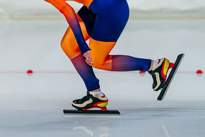 Low section of man skating on floor