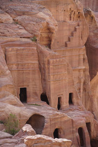 Low angle view of rock formations and ancient ruins