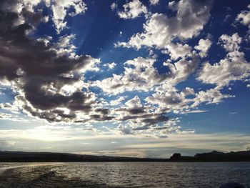 Scenic view of sea against cloudy sky