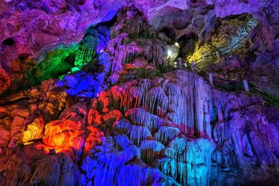 Low angle view of illuminated cave