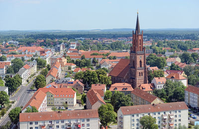 Aerial view of town against clear sky