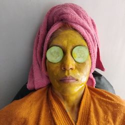 Close-up portrait of woman covering face