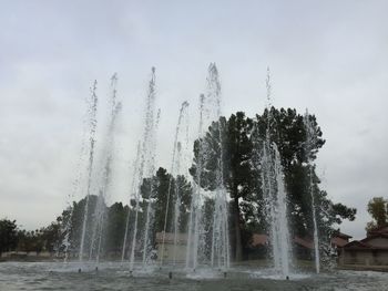 Low angle view of fountain against sky