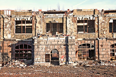 Old abandoned building against sky