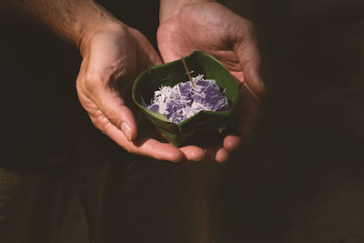 Close-up of person holding dessert