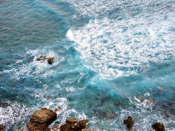 High angle view of rocks in sea