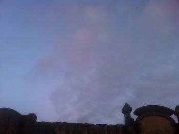 Low angle view of people against sky