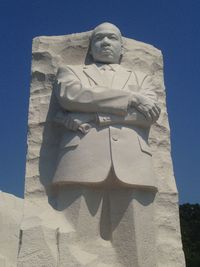 Low angle view of statue against sky