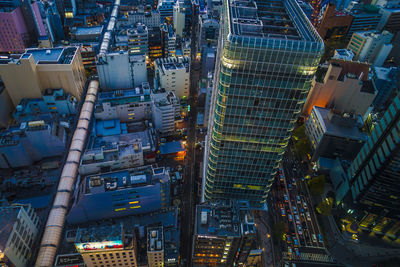 High angle view of illuminated buildings in city