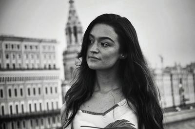 Portrait of beautiful woman in city