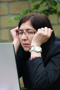 Portrait of woman using mobile phone