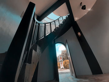 Low angle view of bridge and buildings against sky