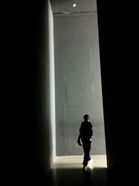 Silhouette man standing against white background