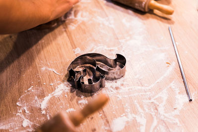 High angle view of hand holding hands