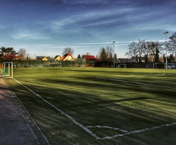 Scenic view of soccer field against sky